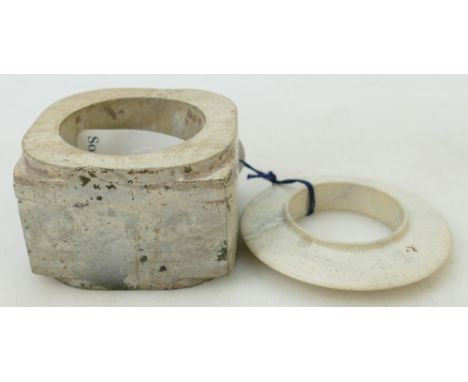 Two Archaistic Jade carvings: Comprising a calcified jade Cong and a pale grey collard disc, the largest 10.3cm. Provenance C