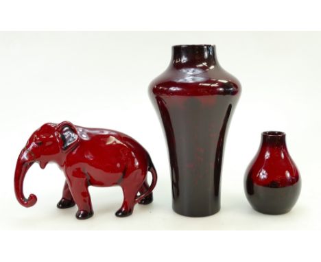 A collection of Royal Doulton Flambé items: Flambé items including - elephant with trunk down (trunk restuck) and two vases (