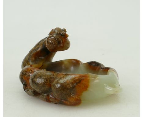Chinese carved jade bowl in form of camel: A well carved piece incorporating darker outer rock in design.  Measures 10cm x 7c