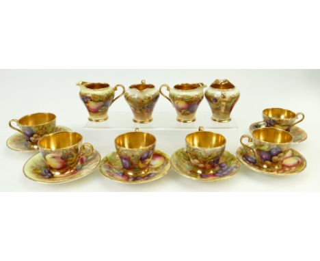 A collection of Aynsley gilded coffee cups and saucers: Aynsley cups and saucers decorated with various fruit by N Brunt toge
