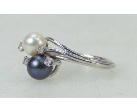 Platinum ladies Pearl and Diamond ring: Ring with black and white pearls set with diamonds, size U, 7.6 grams.