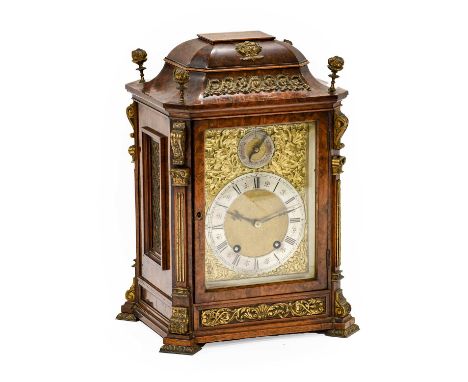 A Burr Walnut Quarter Striking Table Clock, circa 1890, caddied pediment, side sound fret panels, 6-inch brass dial with a si