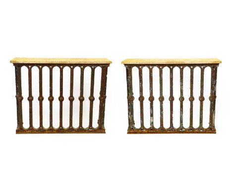 A Pair of Cast Iron Console Tables, late 19th century, the later variegated marble rectangular tops above column and arched s