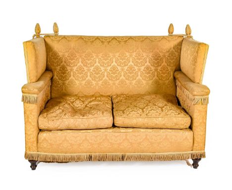 A Mid-20th Century Feather-Filled Knole-Type Sofa, recovered in gold floral silk damask, with drop sides above overstuffed ar