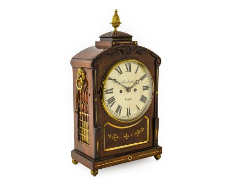 A Mahogany Striking Table Clock, signed John Bentley, London, circa 1840, arched pediment with a pineapple finial, side sound