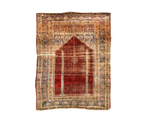 Anatolian Silk Prayer Rug, circa 1900The crimson field with hanging lantern beneath the Mihrab having a lantern flanked by co