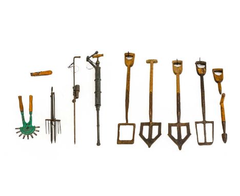 A Collection of Late 19th/Early 20th Century Garden Tools, including various clay spades, brass garden syringes, brass conser