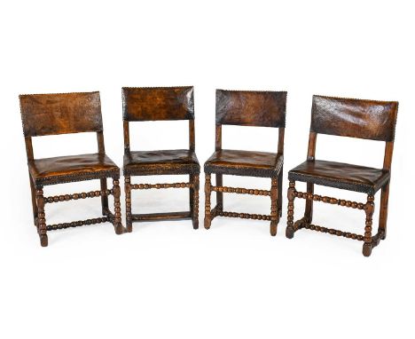 A Matched Set of Four 17th Century Walnut Back Stools, covered in close-nailed brown leather, comprising three with bobbin tu