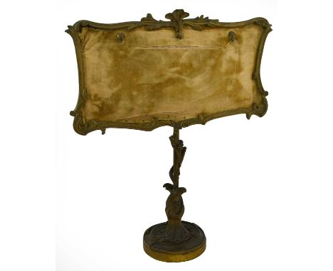 A Gilt Metal Portrait Miniature Stand, mid 19th century, of rectangular form with foliate and scroll cast frame on a foliate 