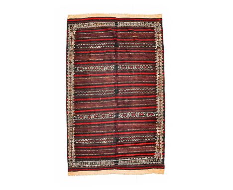 An Afghan Baluch Kilim, circa 1950, the pale aubergine field with wide and narrow bands of geometric devices, woven in two ha