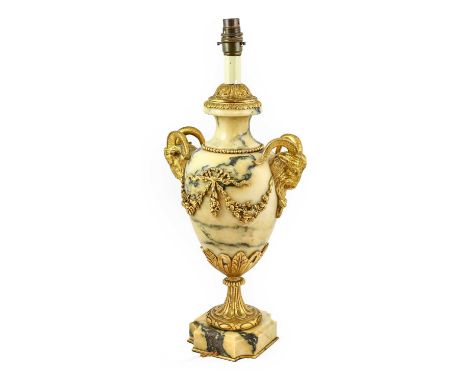 A Gilt Metal Mounted Veined Yellow Marble Lamp Base, in Louis XVI style, of baluster form, the ram's mask handles hung with f