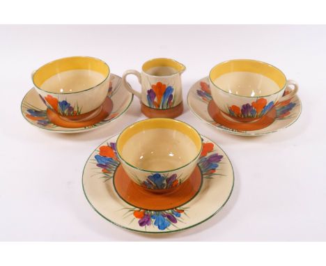 A Clarice Cliff Bizarre part breakfast set in the Crocus pattern, comprising two cup and saucers, 6" plate, sugar bowl and mi