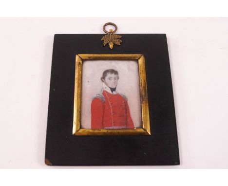 An early 19th century portrait miniature of an Officer, watercolour on ivory, 6.3cm x 5cm, in ebonised frame