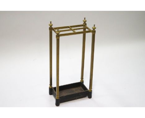 A brass stick stand with four compartments, 60cm high x 28cm wide x 17cm high