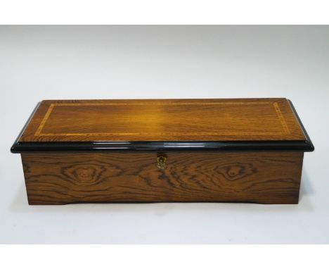 A late 20th century Reuge Swiss music box playing four airs and with 144 tones, stamped 1419, with leaflet and key, 51cm wide