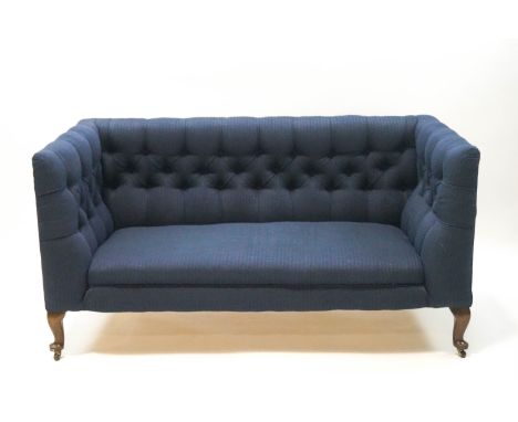 A Victorian button back sofa upholstered in petrol blue fabric on mahogny cabriole legs, 78cm high x 147cm wide x 67cm deep