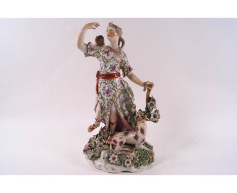 A Derby porcelain figure of Diana with a hound at her feet, holding a bow and drawing an arrow, late 18th century, 26cm high