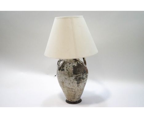 A decorative terracotta two handled jar, converted to a table lamp with shade, 82cm high (including shade)