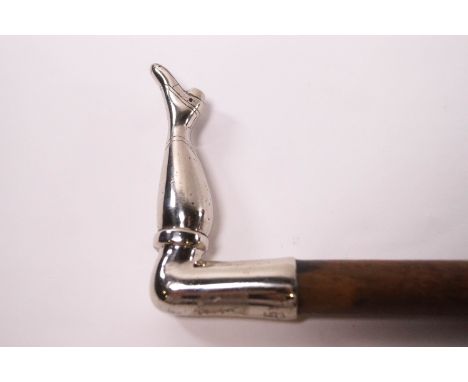 An Edwardian style walking stick with white metal ladies leg handle