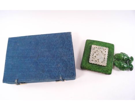 A Chinese earthenware and enamel hand mirror with brass mount, inset pierced and jade panel, carved with a bird, the green en