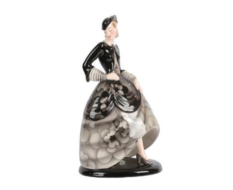 An Art Deco Goldscheider Pottery Figure, by Claire Weiss, modelled a woman wearing a floral black and grey dress and black an