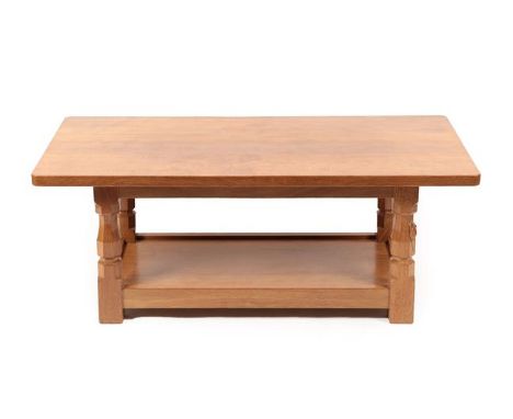 Workshop of Robert Mouseman Thompson (Kilburn): An English Oak 4ft Coffee Table, the rectangular adzed top above a shelf, on 