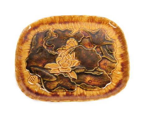 Christopher Dresser (Scottish, 1834-1904) for Linthorpe Pottery: A Tray, decorated with water lilies, impressed HT (Henry Too