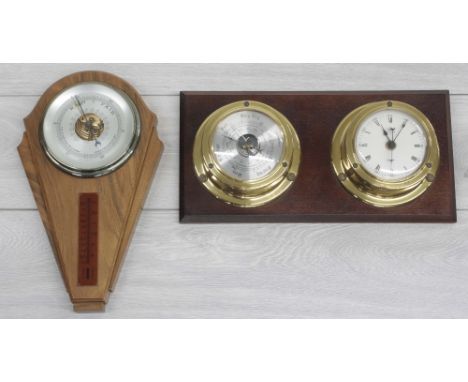 Modern replica brass cased ships porthole wall clock/barometer compendium on wooden mount, 14" wide, 7" high; together with a