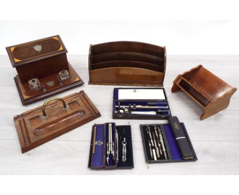 Selection of wooden desk items; including stationery rack, book stand, ink stand and desk stand; also a selection of cased te