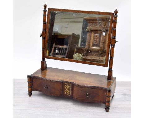 Early 19th century mahogany dressing table mirror, the rectangular plate upon barrel turned supports over the serpentine box 