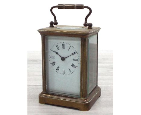 Brass carriage clock timepiece in a corniche case, the back plate unsigned, 6" high including handle