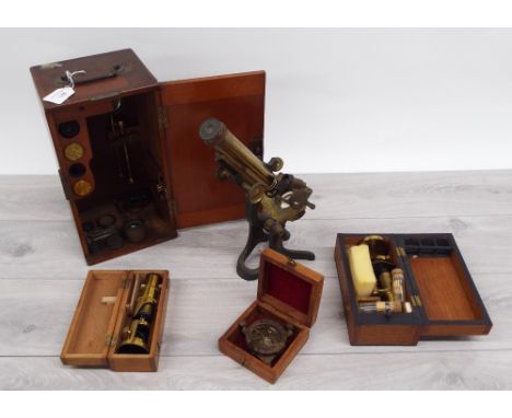 Brass cased microscope by J.H Steward 406 Strand London, within a fitted wooden case with selected accessories and slides con