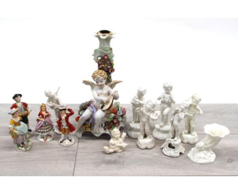 Von Schierholz German porcelain cherub and floral encrusted candlestick, modelled playing mandolin, 10" high; together with a
