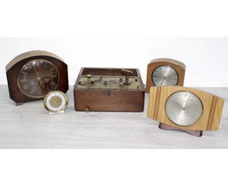 Three vintage mantel clocks, two by Smiths and one Metamec; together with a 'Baby Ben' travel clock and another piece of cloc