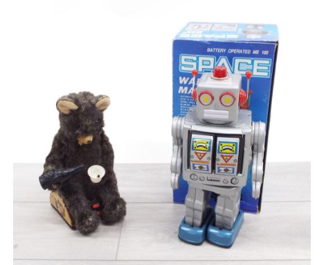 Vintage Japanese automaton bear, seated on a tin trunk pouring from a bottle, bearing Alps and VIA trademarks, made by RVT Ja