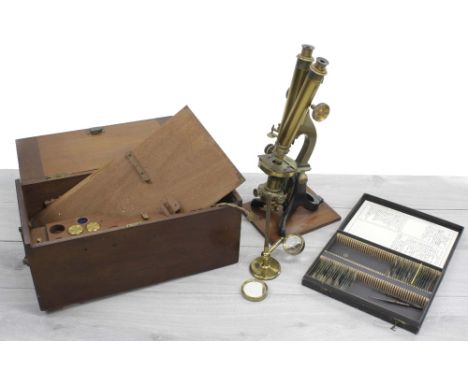 Lacquered brass binocular microscope, marked Hunter &amp; Sons, London, 18" high within a fitted wooden case with cased lense