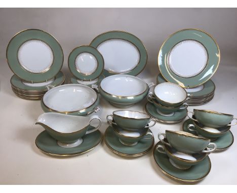 A vintage Chinastyle Simpsons (potters) green and gilded dinner service. Comprising 8 soup bowls and saucers, 8 dinner plates