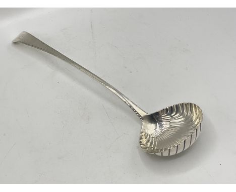Large Georgian shell bowl ladle, with engraved monogram to handle. Makerâ€™s mark for Hester Bateman of London. Hallmarked Lo