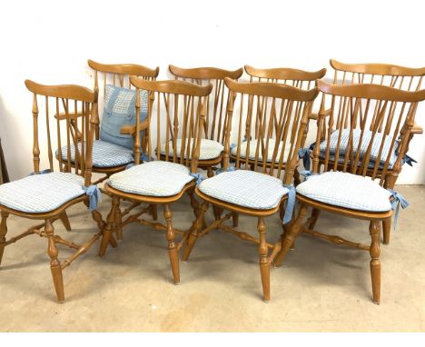 A set of eight hard wood Eastern European stick back kitchen chairs to include two carvers. 