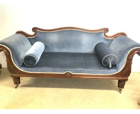A Victorian Biedermeier style scroll arm sofa with curved back rest on wide turned legs with brass castors. W:217cm x D:65cm 
