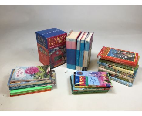 The first four Harry Potter books in a cardboard sleeve - faded spines, also with other childrens books including Enid Blyton