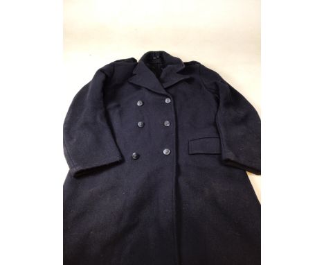 A Policemans overcoat - epaulettes numbered 3330. 44 inch x chest. Length 42 inches 