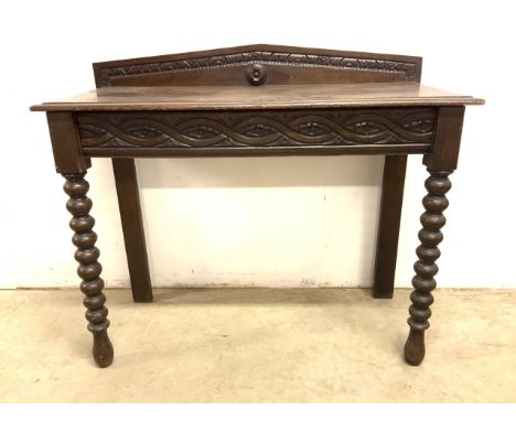 An 18th-19th century carved hall table, with hidden drawer to front, bobbin turned front legs with plank back legs. 