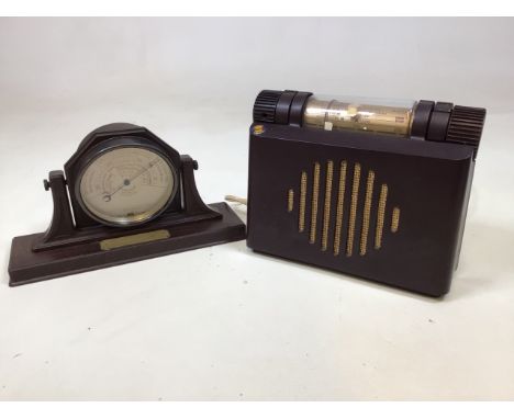 A Bakelite barometer with presentation plaque dated 1933 also with a Bakelite Murphy radio 