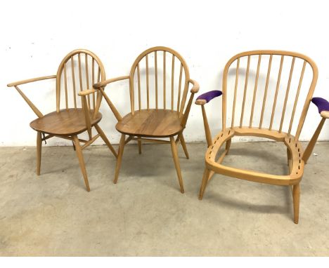 A pair of Ercol blonde Windsor carver arm chairs (With label) also with an Ercol style low arm chair.(no label)Seat height H: