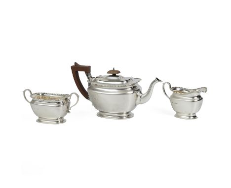 Silver tea set comprising teapot, H14.5cm, sugar bowl and milk jug with pie crust rim all raised on pedestal base, the teapot