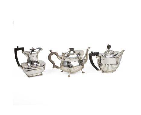 Silver teapots - three assorted teapots all with ebonised handles and finials. One with ribbed body, hallmarked Goldsmiths &a