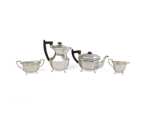 Silver four piece matched tea set of octagonal form and raised on lion paw supports, comprising milk/cream jug, sugar bowl, c