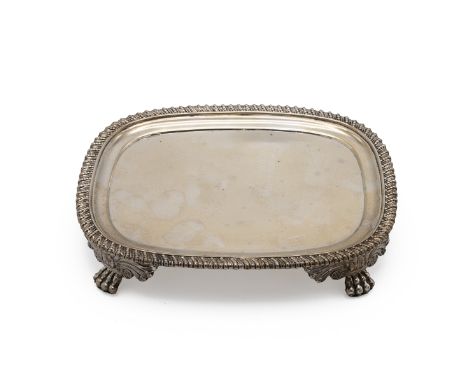 George III silver teapot stand, with a gadrooned border and standing on four outstretched paw feet, London 1778, makers mark 