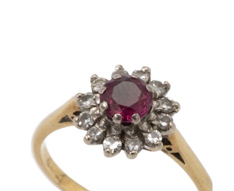 18ct gold ruby and diamond cluster ring, finger size R, 4.2 grams gross.